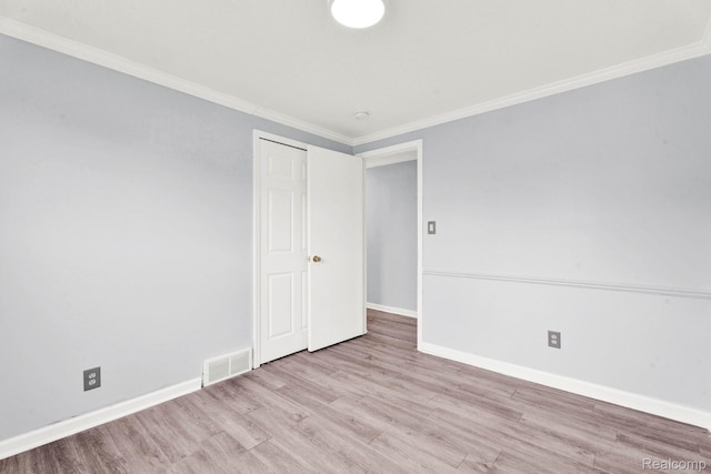 14717 Dane Ct, Sterling Heights, MI 48312 - empty room featuring wood finished floors and crown molding