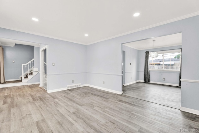 14717 Dane Ct, Sterling Heights, MI 48312 - spare room featuring wood finished floors, stairway, ornamental molding, and recessed lighting