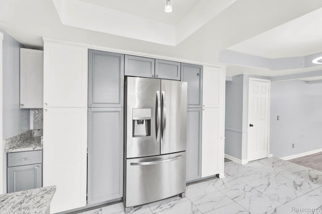 14717 Dane Ct, Sterling Heights, MI 48312 - kitchen with stainless steel fridge, a raised ceiling, light marble finish floors, and gray cabinets