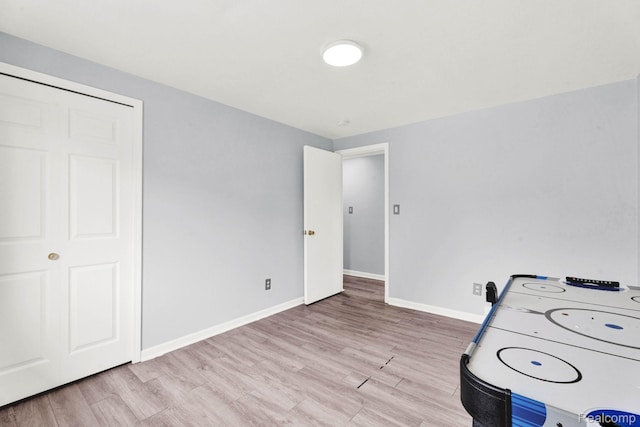 14717 Dane Ct, Sterling Heights, MI 48312 - recreation room featuring light wood-style floors and baseboards