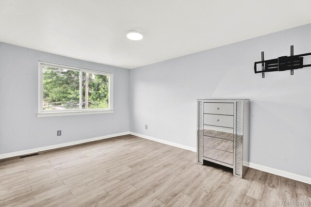 14717 Dane Ct, Sterling Heights, MI 48312 - unfurnished bedroom featuring wood finished floors and baseboards