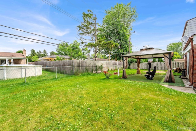 14717 Dane Ct, Sterling Heights, MI 48312 - fenced backyard with a gazebo
