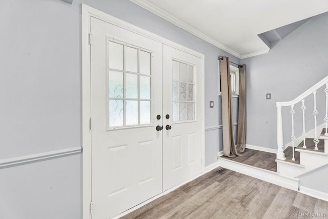 14717 Dane Ct, Sterling Heights, MI 48312 - entrance foyer with wood finished floors, stairs, ornamental molding, and french doors