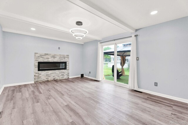 14717 Dane Ct, Sterling Heights, MI 48312 - unfurnished living room with beam ceiling, wood finished floors, a fireplace, a chandelier, and recessed lighting