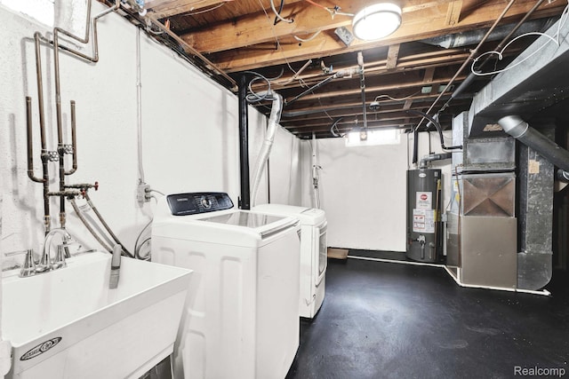 14717 Dane Ct, Sterling Heights, MI 48312 - washroom featuring gas water heater, washer and clothes dryer, and heating unit