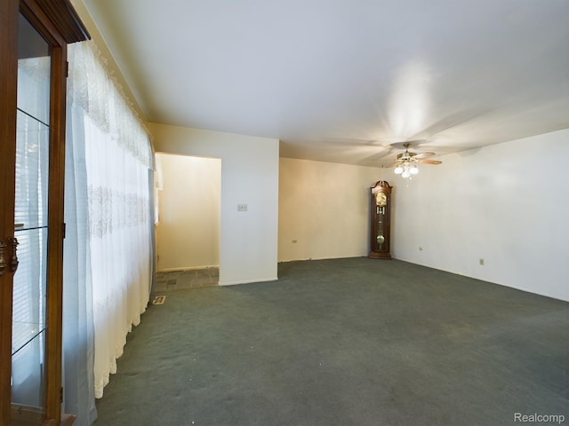 1023 Normandy Terrace Dr, Flint, MI 48532 - unfurnished room featuring ceiling fan and dark colored carpet