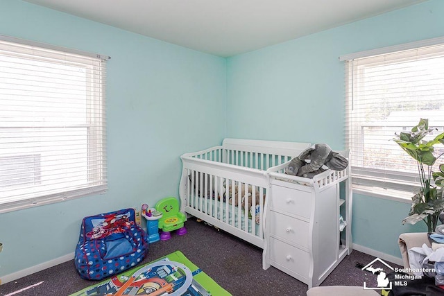 1151 July Dr, Adrian, MI 49221 - bedroom featuring a nursery area and carpet