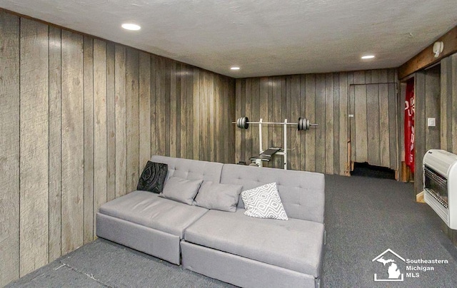1151 July Dr, Adrian, MI 49221 - living room with wood walls, heating unit, carpet flooring, and recessed lighting