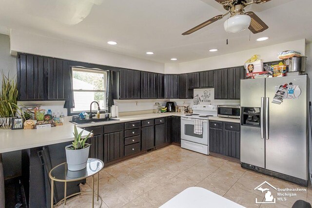 1151 July Dr, Adrian, MI 49221 - kitchen featuring stainless steel appliances, a ceiling fan, light countertops, recessed lighting, and light tile patterned flooring
