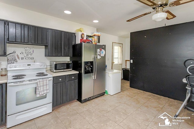 1151 July Dr, Adrian, MI 49221 - kitchen featuring stainless steel appliances, light countertops, ceiling fan, dark cabinets, and recessed lighting