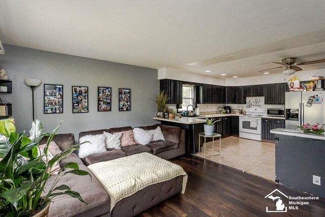 1151 July Dr, Adrian, MI 49221 - living room with recessed lighting, light wood finished floors, and ceiling fan