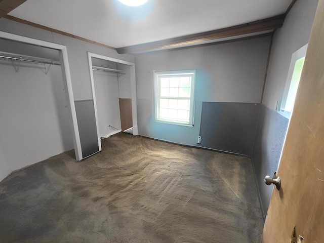 2715 Garfield Rd, Remus, MI 49340 - unfurnished bedroom featuring carpet and two closets