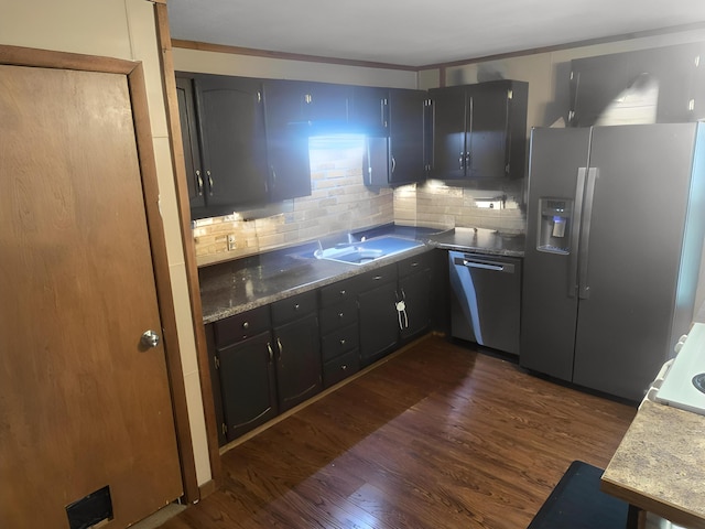 2715 Garfield Rd, Remus, MI 49340 - kitchen featuring appliances with stainless steel finishes, dark wood-type flooring, and tasteful backsplash