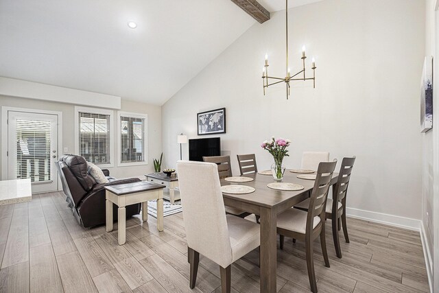 2005 Celadon Dr NE Unit 12, Grand Rapids, MI 49525 - dining space with a chandelier, light wood-style floors, beamed ceiling, and high vaulted ceiling