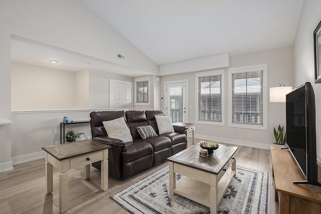 2005 Celadon Dr NE Unit 12, Grand Rapids, MI 49525 - living room with vaulted ceiling and light wood-style floors