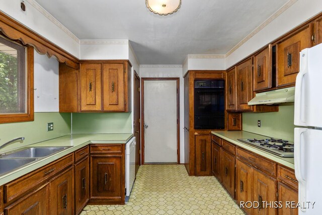 10975 Campanel Dr, Zeeland, MI 49464 - kitchen featuring white appliances, under cabinet range hood, a warming drawer, light floors, and light countertops