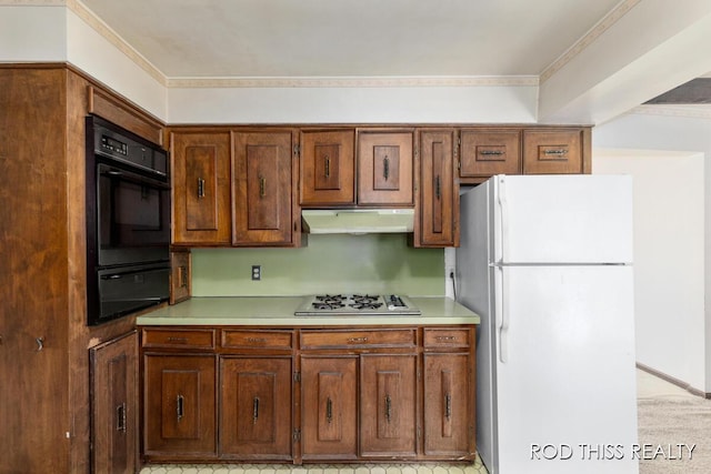 10975 Campanel Dr, Zeeland, MI 49464 - kitchen featuring freestanding refrigerator, a warming drawer, under cabinet range hood, stainless steel gas cooktop, and light countertops