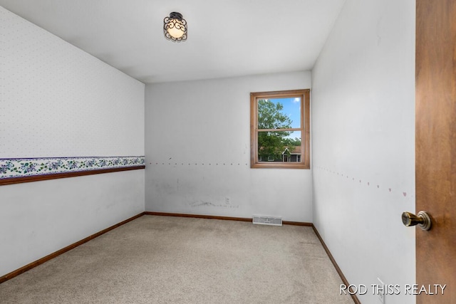 10975 Campanel Dr, Zeeland, MI 49464 - carpeted spare room featuring baseboards and wallpapered walls
