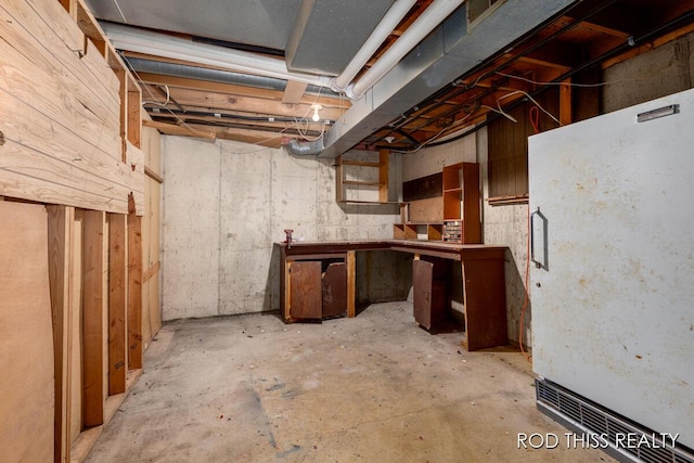 10975 Campanel Dr, Zeeland, MI 49464 - unfinished basement with white refrigerator
