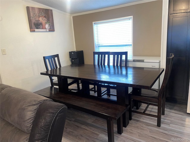 43251 Bonaparte, Sterling Heights, MI 48314 - dining area featuring ornamental molding, light wood-style floors, and a textured ceiling