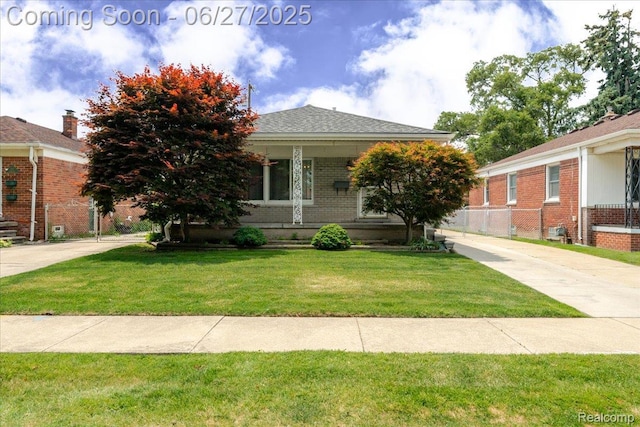 14711 Paris St, Allen Park, MI 48101 - view of front of house featuring brick siding and a front yard