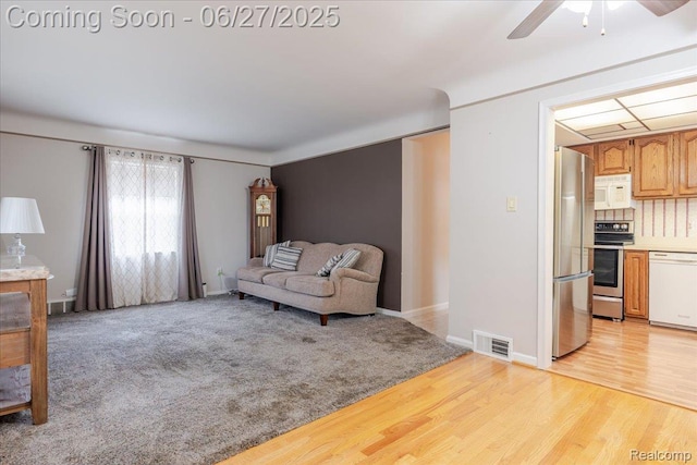 14711 Paris St, Allen Park, MI 48101 - living room with ceiling fan and light wood-style floors