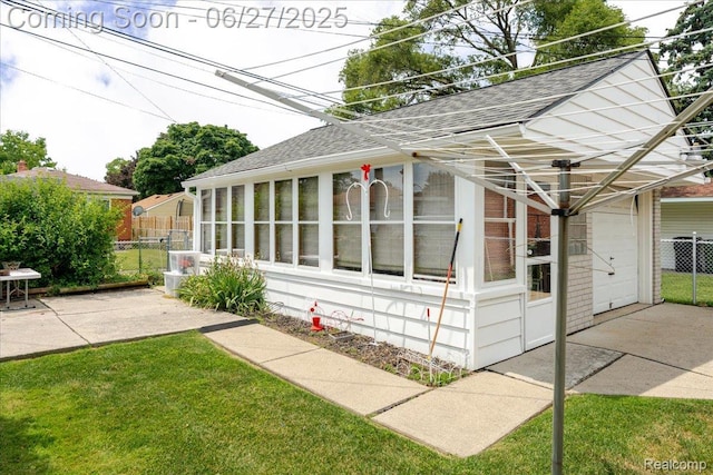 14711 Paris St, Allen Park, MI 48101 - view of property exterior featuring a shingled roof and a sunroom