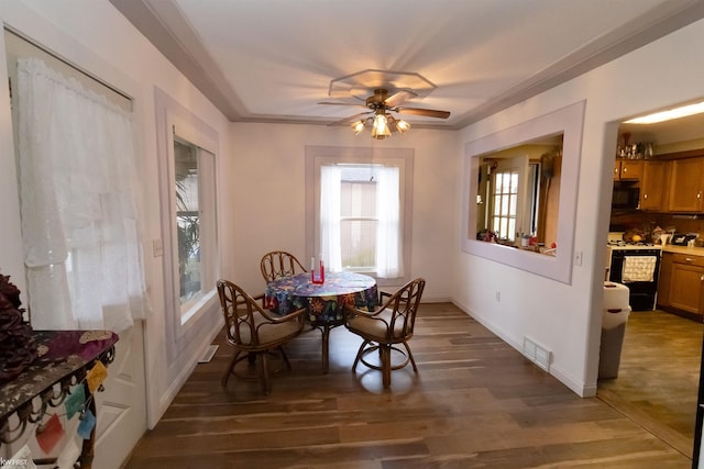 615 Saginaw St, Vassar, MI 48768 - dining room with plenty of natural light, light wood-style flooring, and a ceiling fan