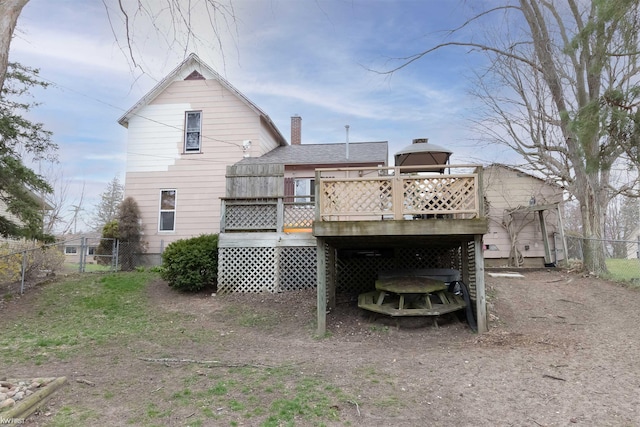 615 Saginaw St, Vassar, MI 48768 - back of house with a deck, a chimney, and a gate