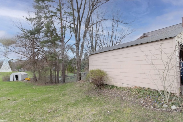 615 Saginaw St, Vassar, MI 48768 - view of green lawn with a storage unit