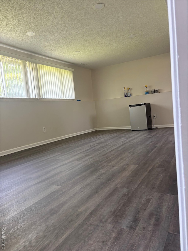 4357 Isabelle St, Inkster, MI 48141 - empty room with a textured ceiling and dark wood finished floors
