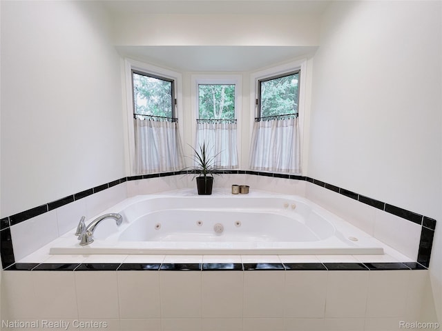 5403 Lenard Cir, Howell, MI 48843 - full bathroom featuring a whirlpool tub and healthy amount of natural light