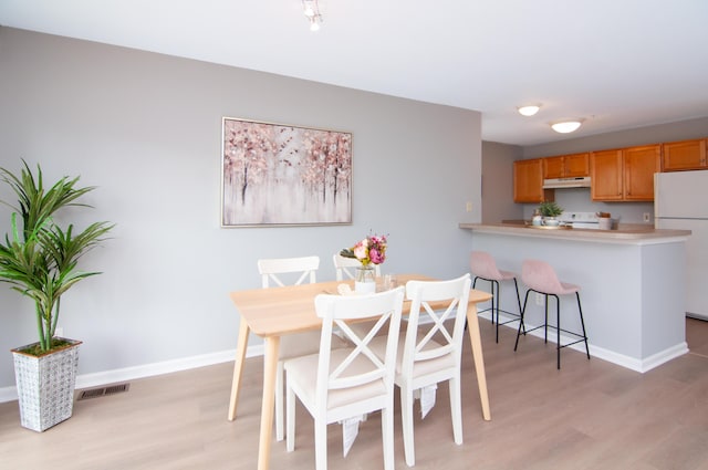 2769 Barclay Way, Ann Arbor, MI 48105 - dining area with light wood-style floors and baseboards