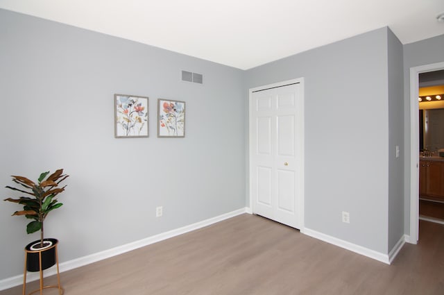 2769 Barclay Way, Ann Arbor, MI 48105 - unfurnished bedroom featuring wood finished floors and baseboards