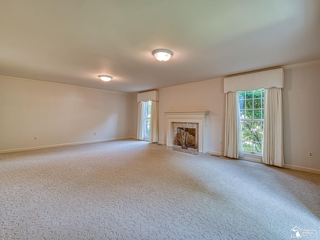 255 Maywood Ave, Monroe, MI 48162 - unfurnished living room featuring healthy amount of natural light, carpet, a high end fireplace, and crown molding