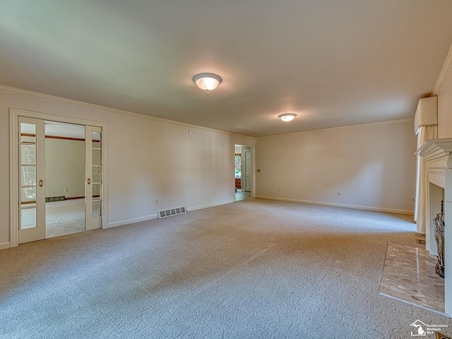 255 Maywood Ave, Monroe, MI 48162 - unfurnished living room featuring crown molding, carpet floors, a fireplace with flush hearth, and french doors