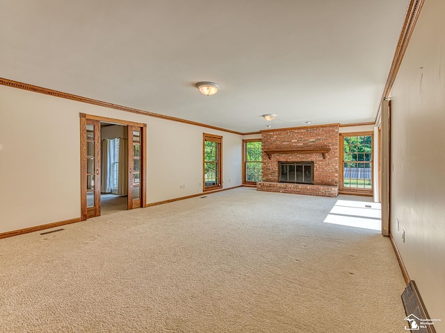 255 Maywood Ave, Monroe, MI 48162 - unfurnished living room featuring crown molding, carpet floors, and a brick fireplace