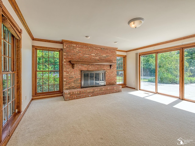 255 Maywood Ave, Monroe, MI 48162 - unfurnished living room with carpet flooring, crown molding, healthy amount of natural light, and a brick fireplace
