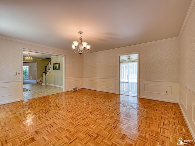 255 Maywood Ave, Monroe, MI 48162 - empty room with a decorative wall, crown molding, a chandelier, a wainscoted wall, and stairs