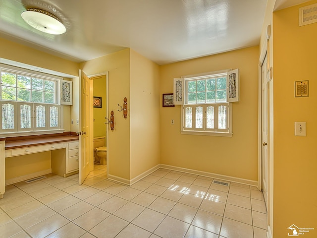 255 Maywood Ave, Monroe, MI 48162 - hall featuring light tile patterned floors and a desk