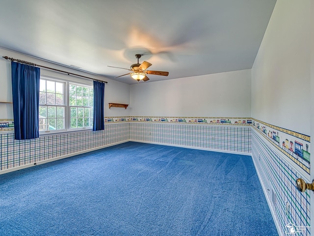 255 Maywood Ave, Monroe, MI 48162 - unfurnished room featuring carpet, ceiling fan, a wainscoted wall, and wallpapered walls