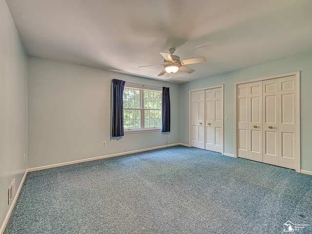 255 Maywood Ave, Monroe, MI 48162 - unfurnished bedroom with two closets, carpet, and a ceiling fan