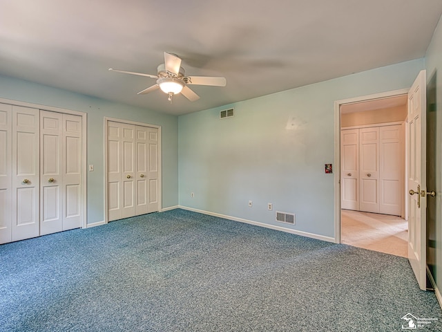 255 Maywood Ave, Monroe, MI 48162 - unfurnished bedroom with carpet flooring, two closets, and ceiling fan