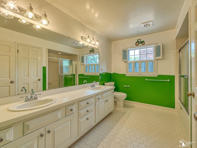 255 Maywood Ave, Monroe, MI 48162 - bathroom featuring double vanity and tile patterned floors