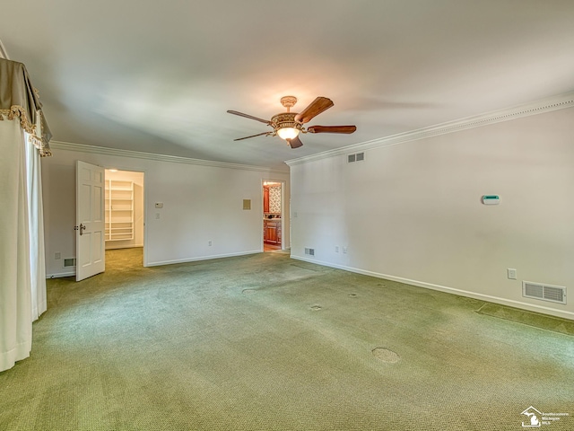 255 Maywood Ave, Monroe, MI 48162 - spare room featuring ornamental molding, a ceiling fan, and carpet flooring
