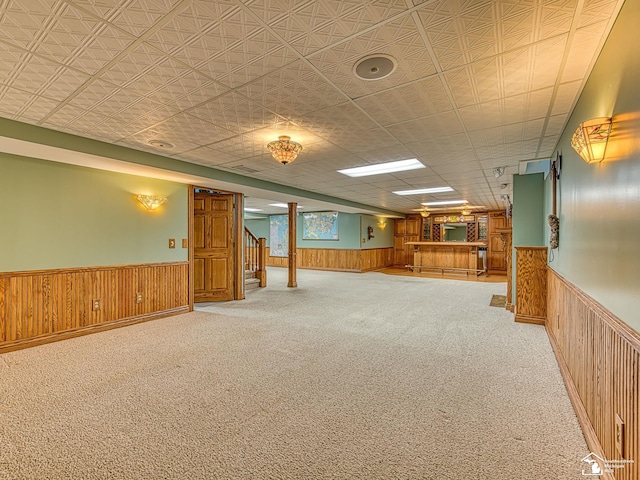 255 Maywood Ave, Monroe, MI 48162 - finished below grade area featuring a wainscoted wall, wood walls, carpet floors, and stairs