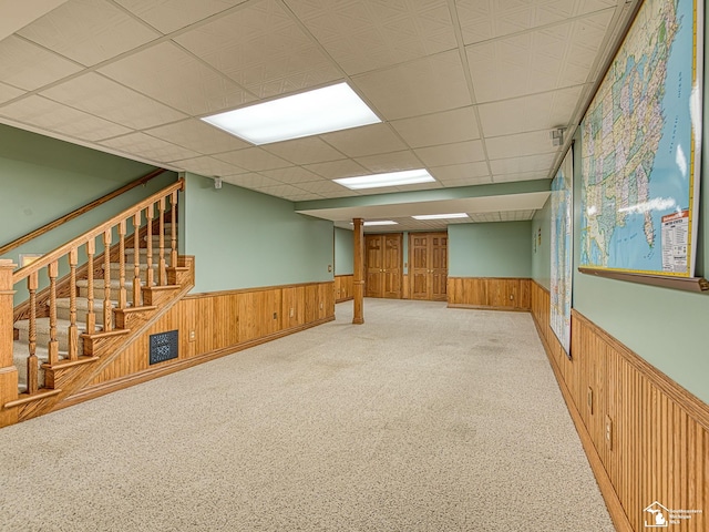 255 Maywood Ave, Monroe, MI 48162 - carpeted spare room featuring wainscoting, wood walls, stairs, and a paneled ceiling