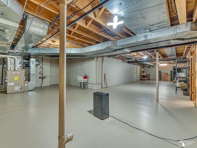 255 Maywood Ave, Monroe, MI 48162 - unfinished below grade area featuring heating unit and concrete block wall