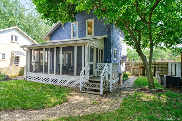 904 Michigan Ave, East Lansing, MI 48823 - back of property featuring a sunroom