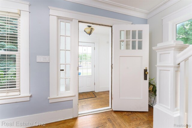 904 Michigan Ave, East Lansing, MI 48823 - foyer entrance featuring plenty of natural light and ornamental molding